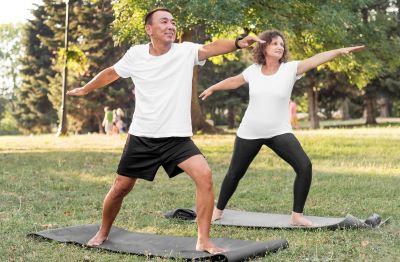 man and woman demonstrating a tai chi pose