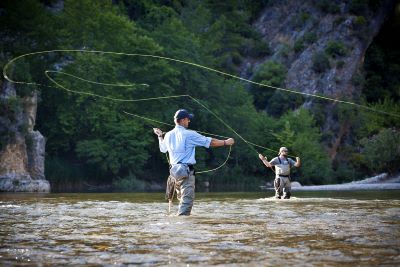 two men in a river fly fishing
