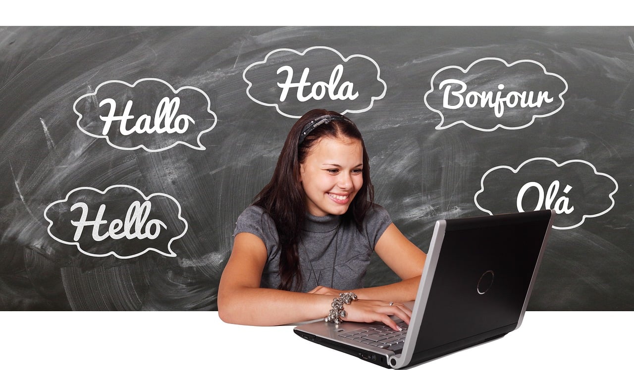 woman on a computer learning Spanish